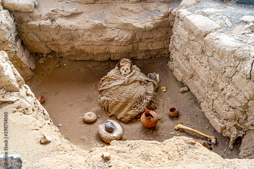 Peru, near Nazca,  the Cemetery Chauchilla. Well preserved mummified bodys from the Nazca civilisation in their open tombs. photo