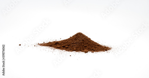 A pile of ground coffee on white background