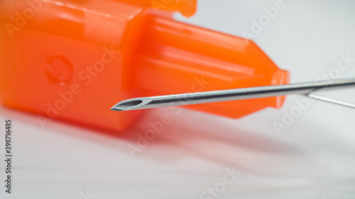 Tip of the medical needle. Shallow depth of field macro photography.