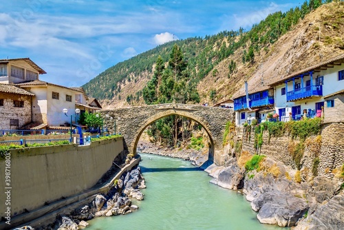 The picturesque colonial Carlos Tercero bridge, built in 1775, spanning the Mapacho River in the town of Paucartambo, in the Cusco region in southern Peru. photo