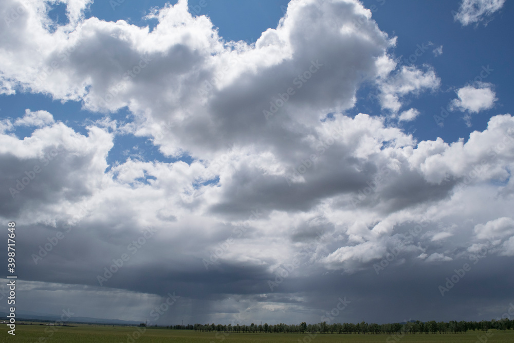 Summer clouds over the valley on a fine windless day