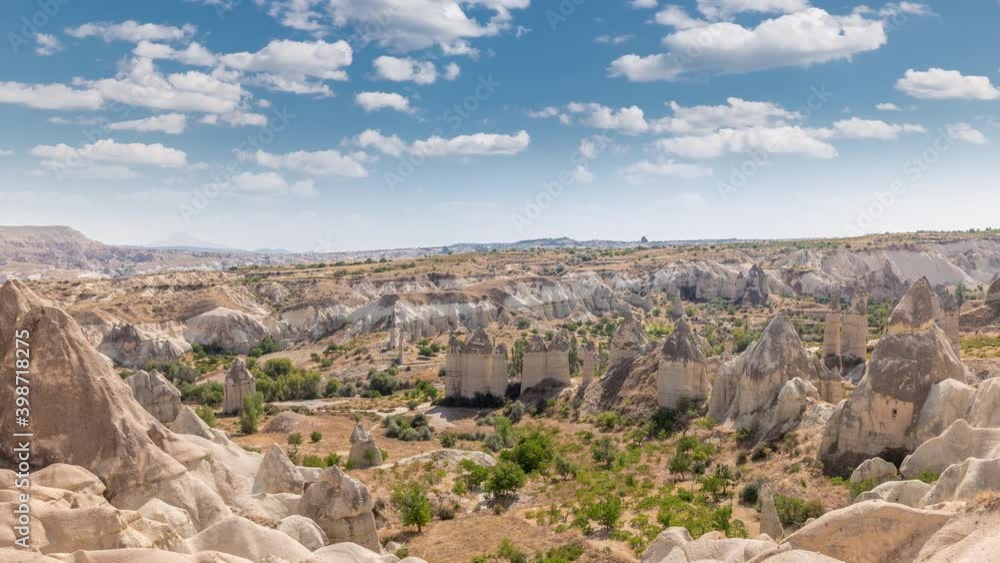 Red Valley and Rose Valley of Goreme of Nevsehir in Cappadocia aerial timelapse, Turkey. Love valley and fairy chimneys panoramic view with clouds on a blue sky Red Valley and Rose Valley of Goreme of Nevsehir in Cappadocia aerial timelapse, Turkey. Love valley and fairy chimneys panoramic view with clouds on a blue sky