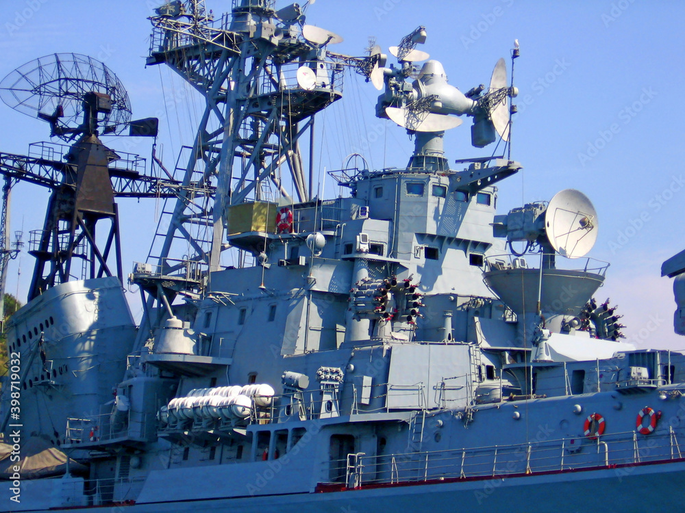 Missile cruiser (warship, battleship) battle ship closeup. Aircraft carrier russian military war battle cruiser ship (army boat) with missile launcher. Warship missile cruiser security navy in water Missile cruiser (warship, battleship) battle ship closeup. Aircraft carrier russian military war battle cruiser ship (army boat) with missile launcher. Warship missile cruiser security navy in water