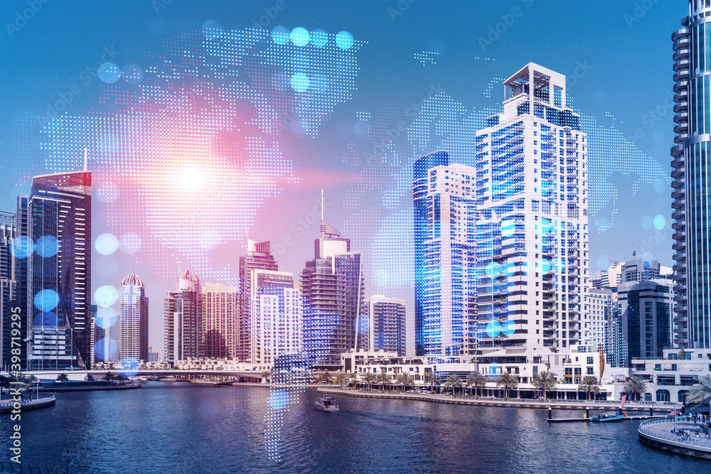 Obraz premium Skyscrapers of Dubai business downtown. International hub of trading and financial services. Social network icons hologram, concept of people connection. Double exposure. Dubai Canal waterfront.