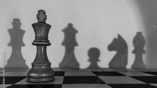 Abstract chess pieces on a chess board