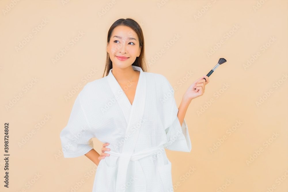 Portrait beautiful young asian woman with makeup brush Portrait beautiful young asian woman with makeup brush