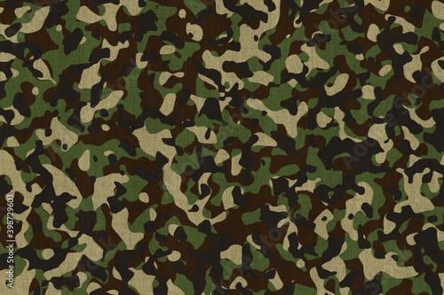 Military camouflage pattern fabric. Background illustration in green and brown.