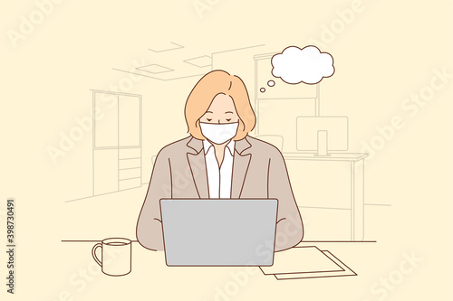 Working during COVID-19 pandemic and wearing medical mask. Woman office worker employee in face mask working alone and keeping social distance during outbreak of pandemic situation