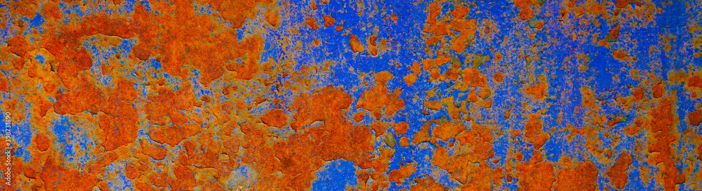 Rusty metal plate background. Bright orange blue abstract background. Old rusty painted wall surface. Multicolor rough texture.Web banner. Website header.