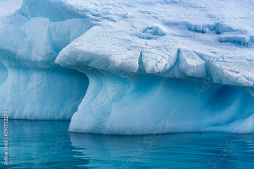 Large iceberg broken off of glacier floats near Antarctica