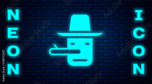 Glowing neon Pinocchio icon isolated on brick wall background.  Vector.