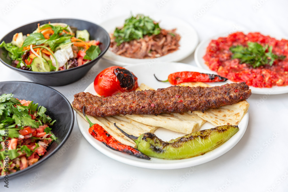 traditional Turkish food, Adana kebap with lamb meat and salad traditional Turkish food, Adana kebap with lamb meat and salad