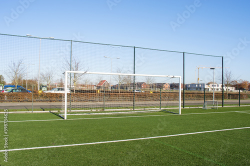 Soccer goal on a soccer field of green artificial grass in Arnhem, Netherlands