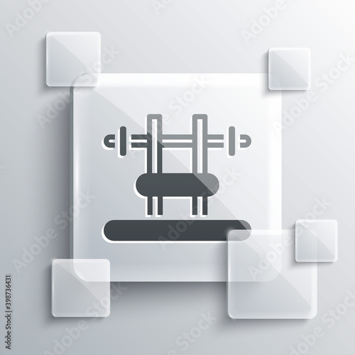Grey Bench with barbel icon isolated on grey background. Gym equipment. Bodybuilding, powerlifting, fitness concept. Square glass panels. Vector.