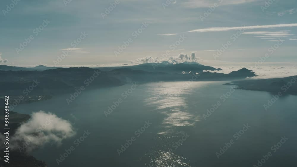 Drone aerial overview of lake Atitlan, high over the clouds in Guatemala Drone aerial overview of lake Atitlan, high over the clouds in Guatemala