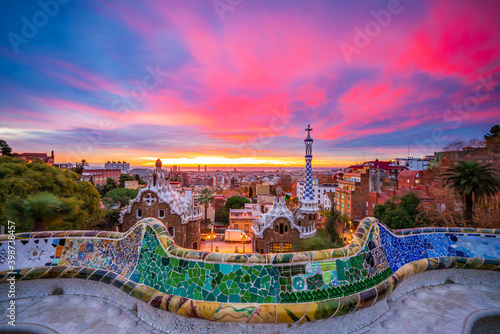 Sunrise in Barcelona seen from Park Guell. Park was built from 1900 to 1914 and was officially opened as a public park in 1926. In 1984, UNESCO declared the park a World Heritage Site