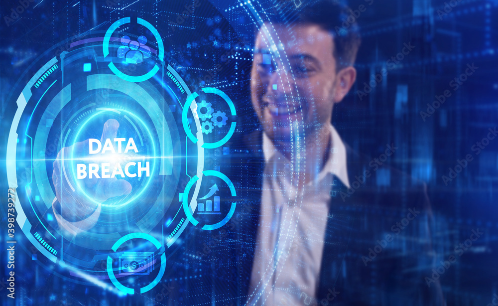 Business, Technology, Internet and network concept. Young businessman working on a virtual screen of the future and sees the inscription: Data breach Business, Technology, Internet and network concept. Young businessman working on a virtual screen of the future and sees the inscription: Data breach