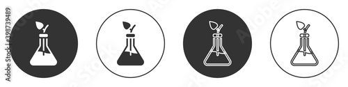 Black Plant breeding icon isolated on white background. Plants growing in the test tubes. Organic food ,agriculture and hydroponic. Circle button. Vector.