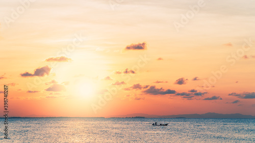 sunset sky over sea in the evening and silhouette fishing boat minimal © Nature Peaceful 