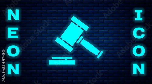 Glowing neon Judge gavel icon isolated on brick wall background. Gavel for adjudication of sentences and bills, court, justice. Auction hammer.  Vector.