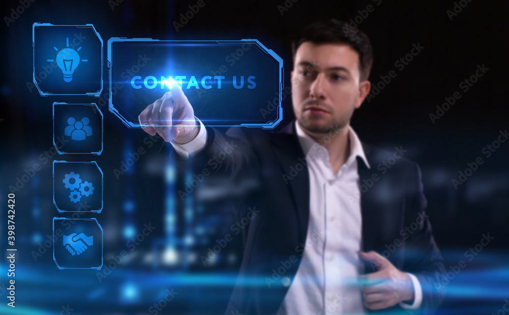 Business, Technology, Internet and network concept. Young businessman working on a virtual screen of the future and sees the inscription: Contact us Business, Technology, Internet and network concept. Young businessman working on a virtual screen of the future and sees the inscription: Contact us