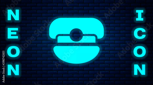 Glowing neon Captain hat icon isolated on brick wall background.  Vector.