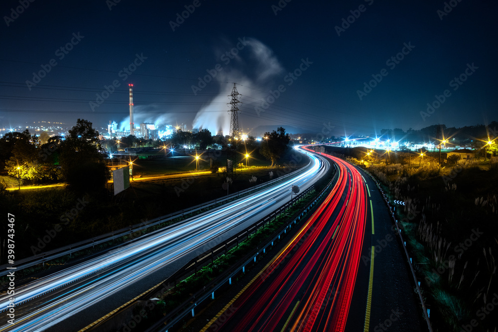 Night view of a highway and a factory in Cantabria, Spain