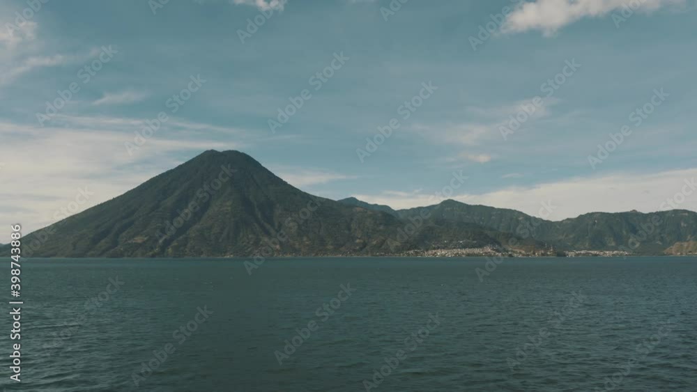 Drone aerial landscape view of volcanoes and lake Atitlan in Guatemala
