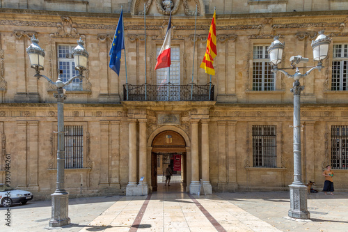facade of Hotel de Ville in Aix en Provence with French, local and european Flag photo