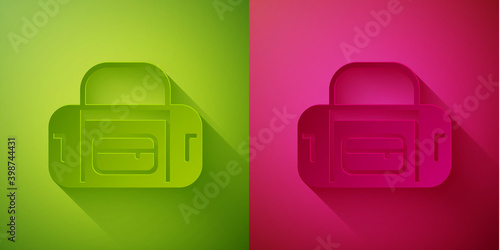 Paper cut Sport bag icon isolated on green and pink background. Paper art style. Vector.