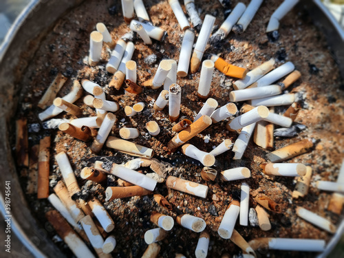 High Angle View of Waste Cigarette Butts with Selective Focus