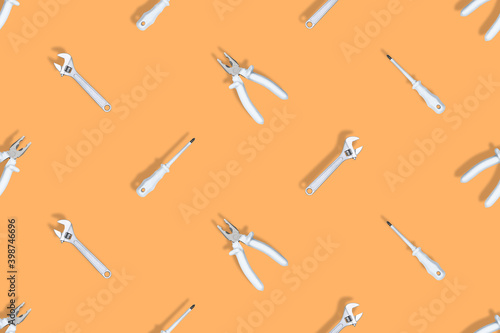 Background made of tools, pliers, screwdriver, wrench. Tools seamless pattern.