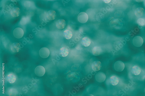 water surface  background with highlights in defocus. abstract tidewater green background