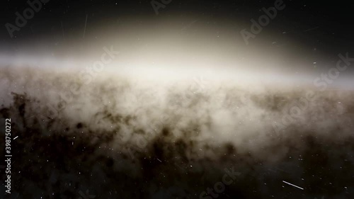 Exploration of galaxies through outer space towards a bright milky-way galaxy. 4K looping animation of flying through bright nebulae, clouds, and star fields. 