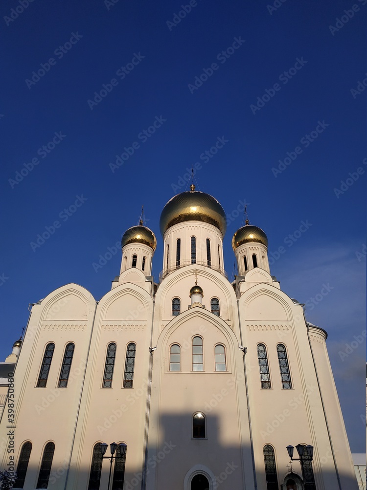 
orthodox cathedral with golden domes against a blue sky