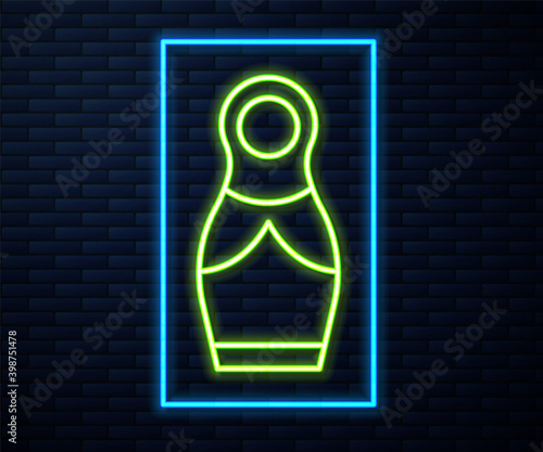 Glowing neon line Russian doll matryoshka icon isolated on brick wall background.  Vector.