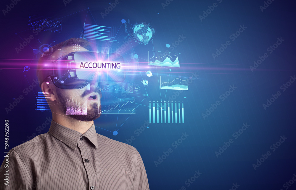 Businessman looking through Virtual Reality glasses with ACCOUNTING inscription, new business concept Businessman looking through Virtual Reality glasses with ACCOUNTING inscription, new business concept