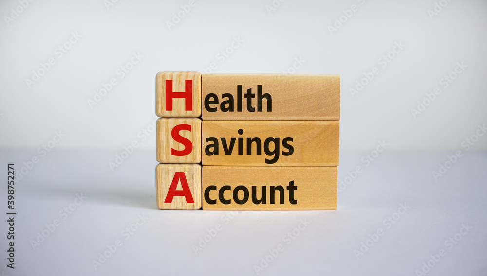 HSA symbol. Wooden cubes and blocks with words 'HSA - Health Savings Account'. Beautiful white background. Business and HSA concept. HSA symbol. Wooden cubes and blocks with words 'HSA - Health Savings Account'. Beautiful white background. Business and HSA concept.