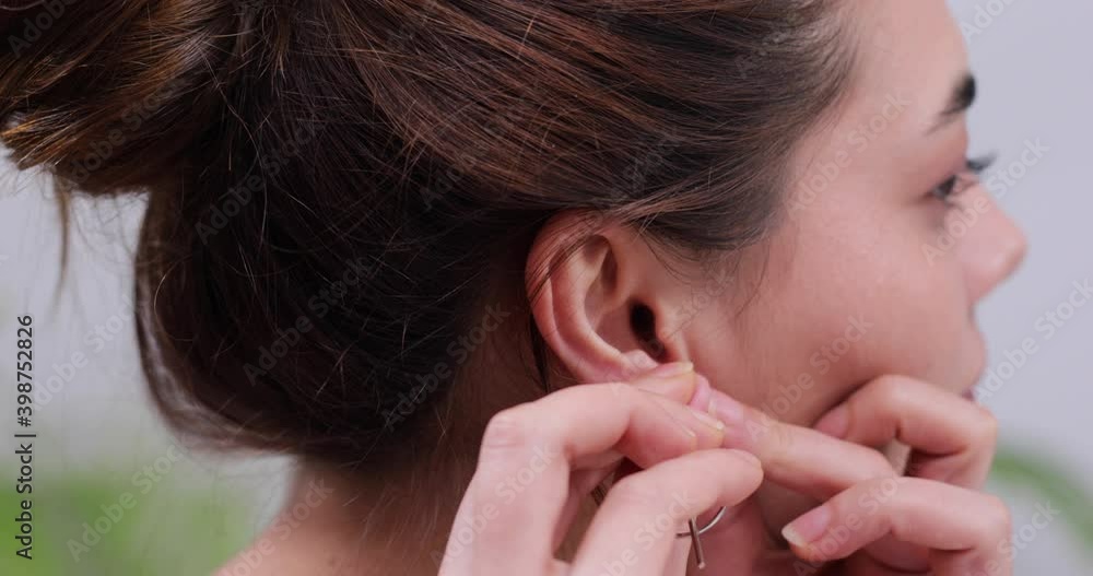 woman wearing earring jewelry woman wearing earring jewelry
