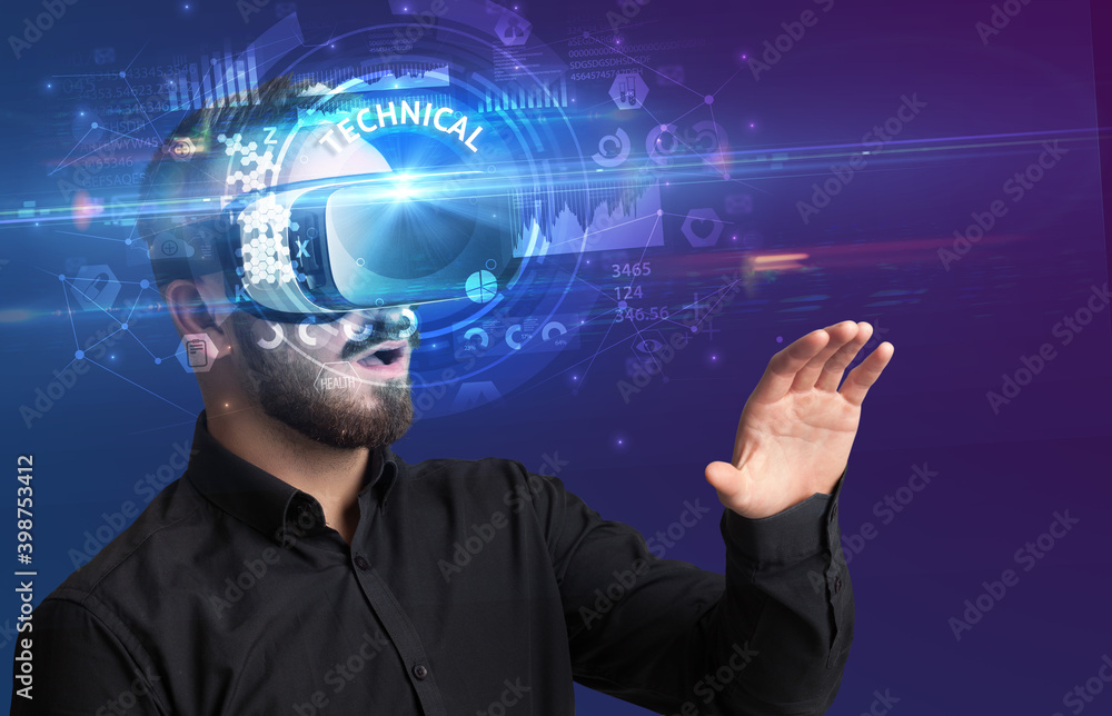 Businessman looking through Virtual Reality glasses with TECHNICAL inscription, innovative technology concept Businessman looking through Virtual Reality glasses with TECHNICAL inscription, innovative technology concept