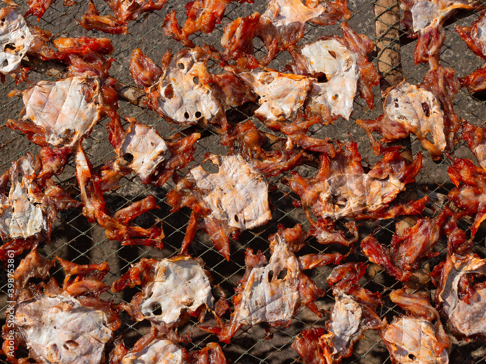 Process of drying crab and fish outdoors under the sun in Vietnam. Treats for tourists. Food background