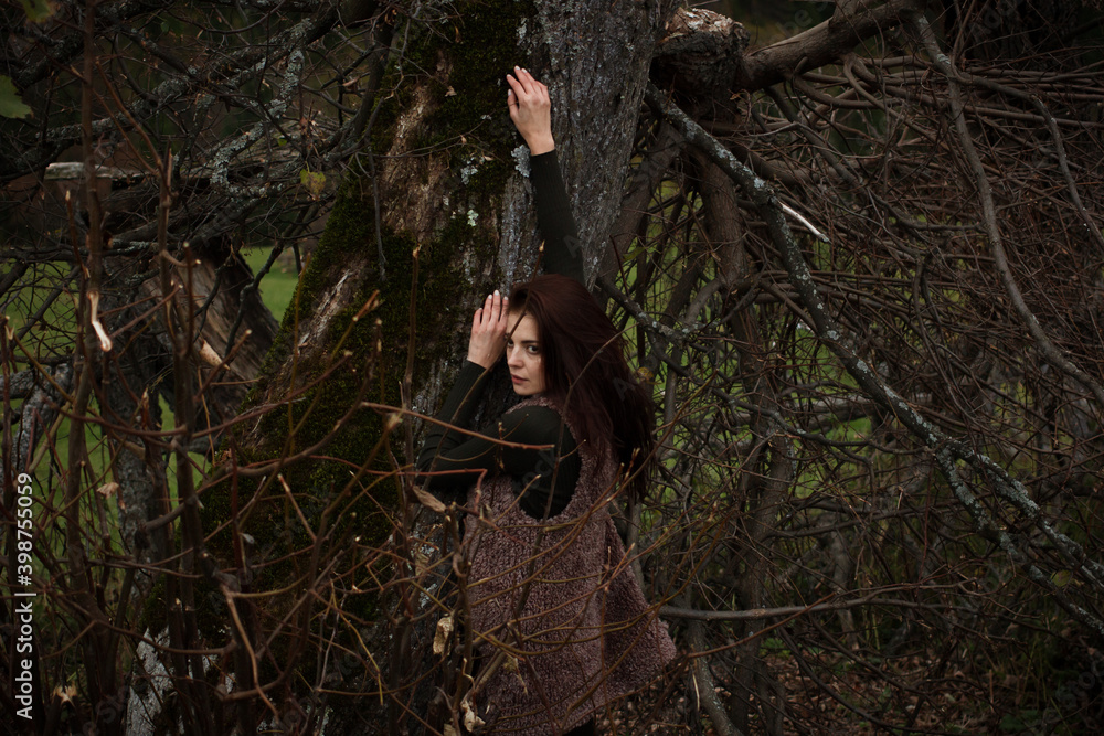 Woman relaxing at tree. Space for text Woman relaxing at tree. Space for text
