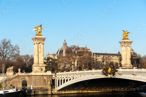 Alexandre III bridge and Petit Palais at golden hour in Autumn - Paris, France © UlyssePixel
