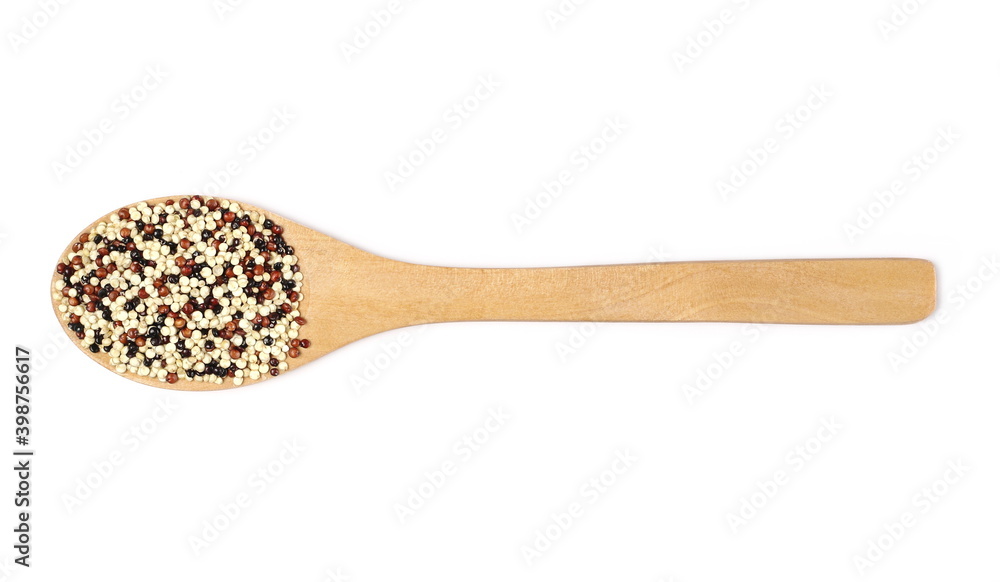 Tri-color quinoa seeds blend in wooden spoon isolated on white background, top view Tri-color quinoa seeds blend in wooden spoon isolated on white background, top view