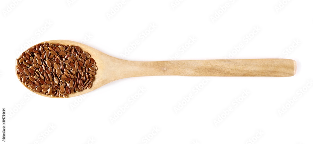 Brown flax seeds, linseed pile with wooden spoon isolated on white background, top view Brown flax seeds, linseed pile with wooden spoon isolated on white background, top view