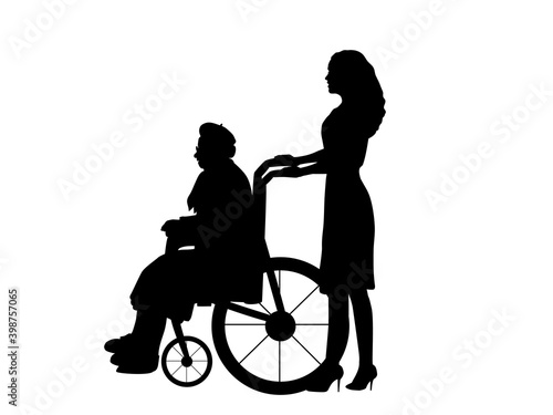 Silhouettes of woman walking her grandmother in wheelchair