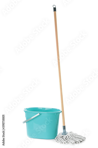 Konstfotografi Mop and plastic bucket on white background. Cleaning supplies