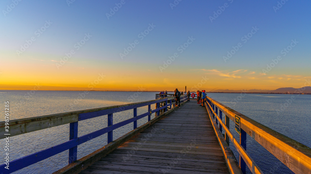 Sunset at public fishing pier on Boundary Bay, BC  early winter