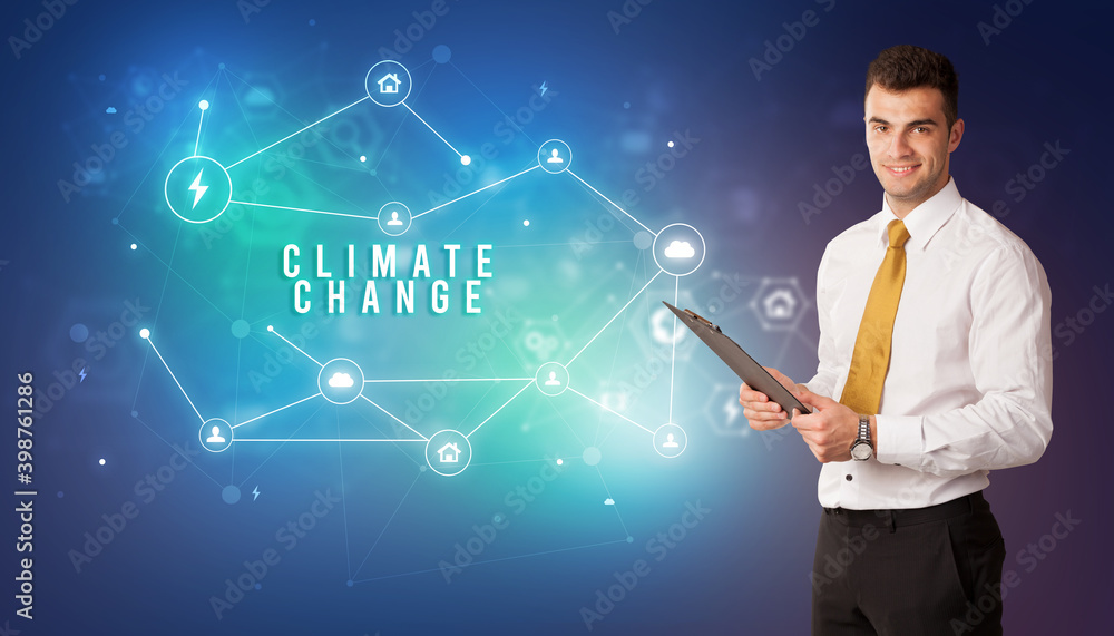 Businessman in front of cloud service icons with CLIMATE CHANGE inscription, modern technology concept Businessman in front of cloud service icons with CLIMATE CHANGE inscription, modern technology concept