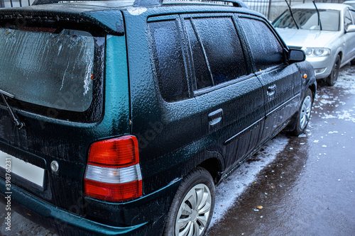 Quadro em tela Black SUV covered with ice after abnormal freezing rain in sub-zero temperatures